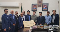 اهدای کتاب نفیس قرآن طباخ به دانشگاه جندی شاپور توسط بانک پاسارگاد